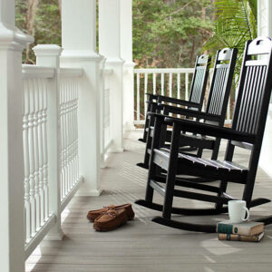 trex-transcend-porch-gravel-path-railings-classic-white-colornial-spindles-outdoor-furniture-black-rockers